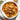 A bowl of rabbit bolognese with a napkin and fork.